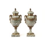 pair of 'antique' neoclassical covered urns in green marble with mountings in gilded bronze ||