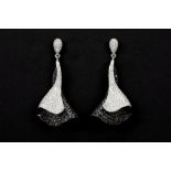 pair of in earrings in partially black patinated white gold (18 carat) with ca 3,40 carat of black