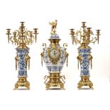 antique 3pc garniture in brass and ceramic with a blue-white decor : a pair of candelabra and a
