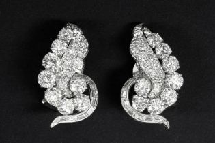 English "Barnett - London" pair of late Art Deco earrings in platinum with ca 6,80 carat of high
