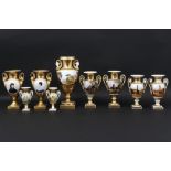 nine small antique vases in porcelain from Brussels ||Lot (9) antieke urnvormige vaasjes met