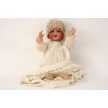 Simon & Halbig marked baby doll with porcelain head and original baptism clothes - to be dated
