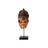 rare Nigerian Ekiti (Yoruba) mask in wood with old patina and covered in wax (?) - on its stand - in