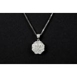 flowershaped pendant in white gold (18 carat) with ca 1,15 carat of high quality brilliant cut