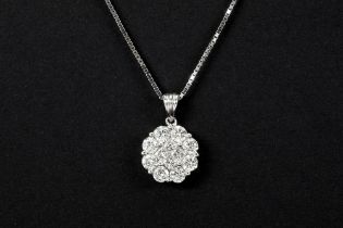 flowershaped pendant in white gold (18 carat) with ca 1,15 carat of high quality brilliant cut