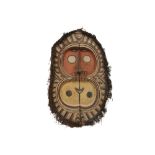 Papua New Guinean Middle Rmau River flute mask in wood with pigments, fibres and seads ||PAPOEASIE