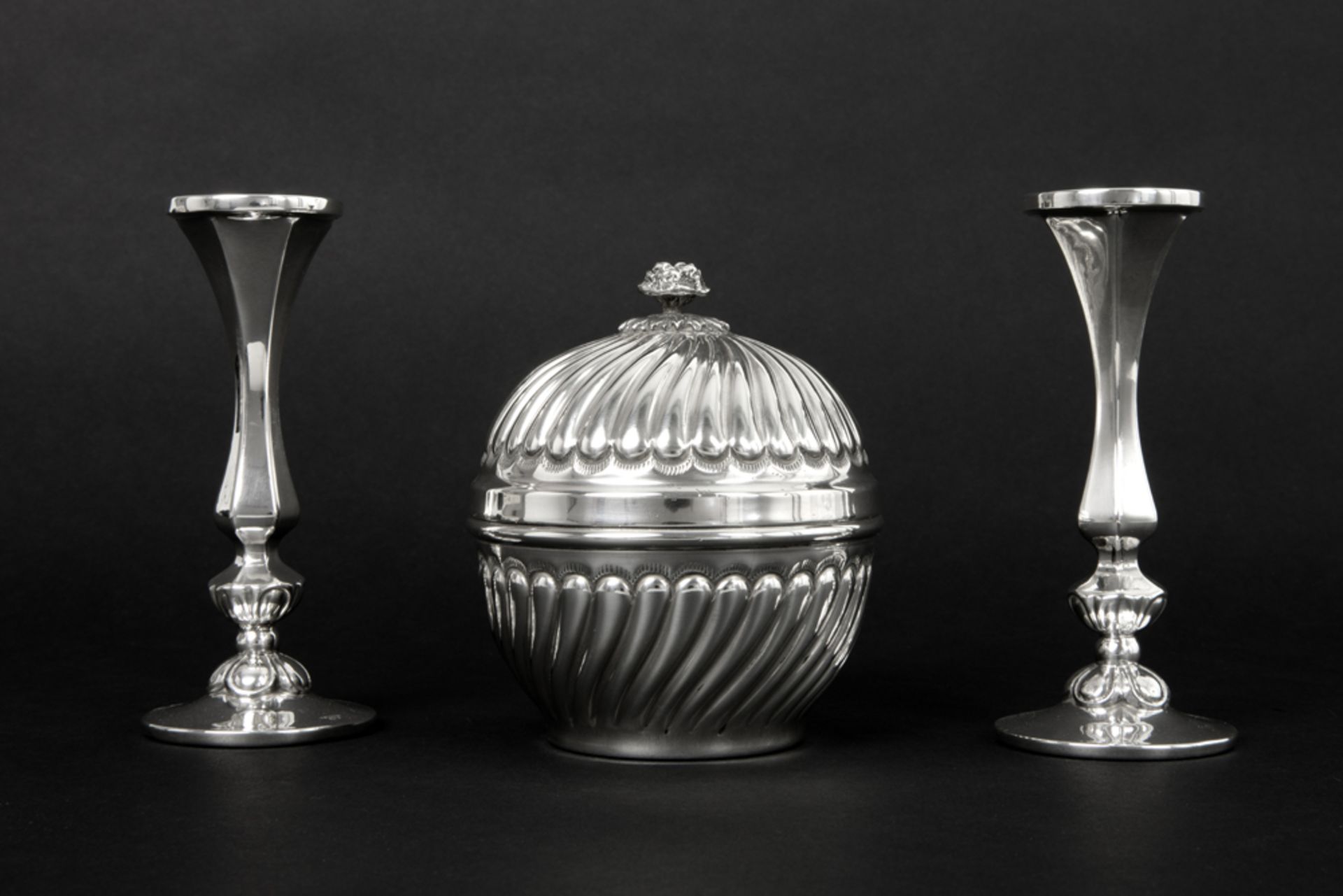 three pieces of marked silver with a pair of small candlesticks and a lidded candy box ||Lot (3)