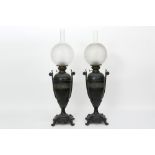 pair of antique paraffin lamps in patinated metal with neoclassical ornamentation || Paar antieke