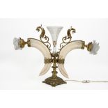 decorative 'antique' table lamp in crystal and gilded metal and with two boar tusks || Decoratieve