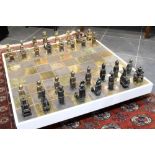 unique late 20th Cent. Belgian chessgame with pieces in glazed ceramic and with its matching table