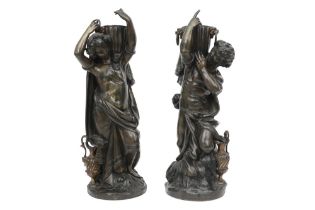 pair of antique bronze sculptures each with a Bacchanal scene with a figure, wine barrel and