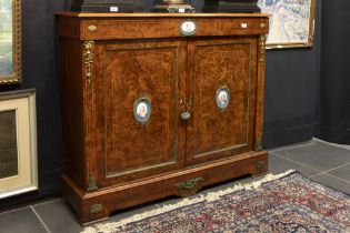 mid 19th Cent. European neoclassical cabinet in burr of walnut with mountings in guilded bronze