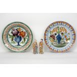 pair of marked dishes and a pair of Chinese style figures in Delft style ceramic with a polychrome