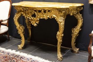 an 1848 dated Louis XV style Napoleon III console in gilded and richly sculpted wood with a thick