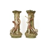 pair of 'antique' vases (each with a figure) in Royal Dux marked porcelain || Paar vazen van ca 1900