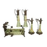 five pieces of Art Nouveau style ceramic with bronze mountings and whiplash ornamentation : four