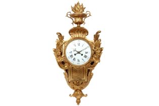 antique French wall clock with its baroque style case in gilded bronze and with a signed work from
