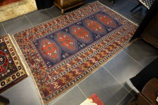'antique' 1910 dated Caucasian rug in wool on wool with a geometric designs and nicely patinated