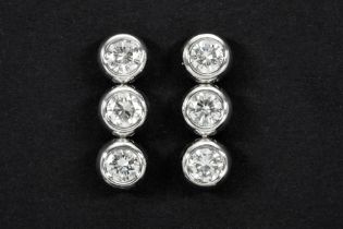 beautiful pair of earrings in white gold (18 carat) each with three brilliants - in total : ca 1,