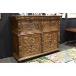 17th Cent. Flemish baroque style cupboard in oak with typical, sculpted ornamentation with