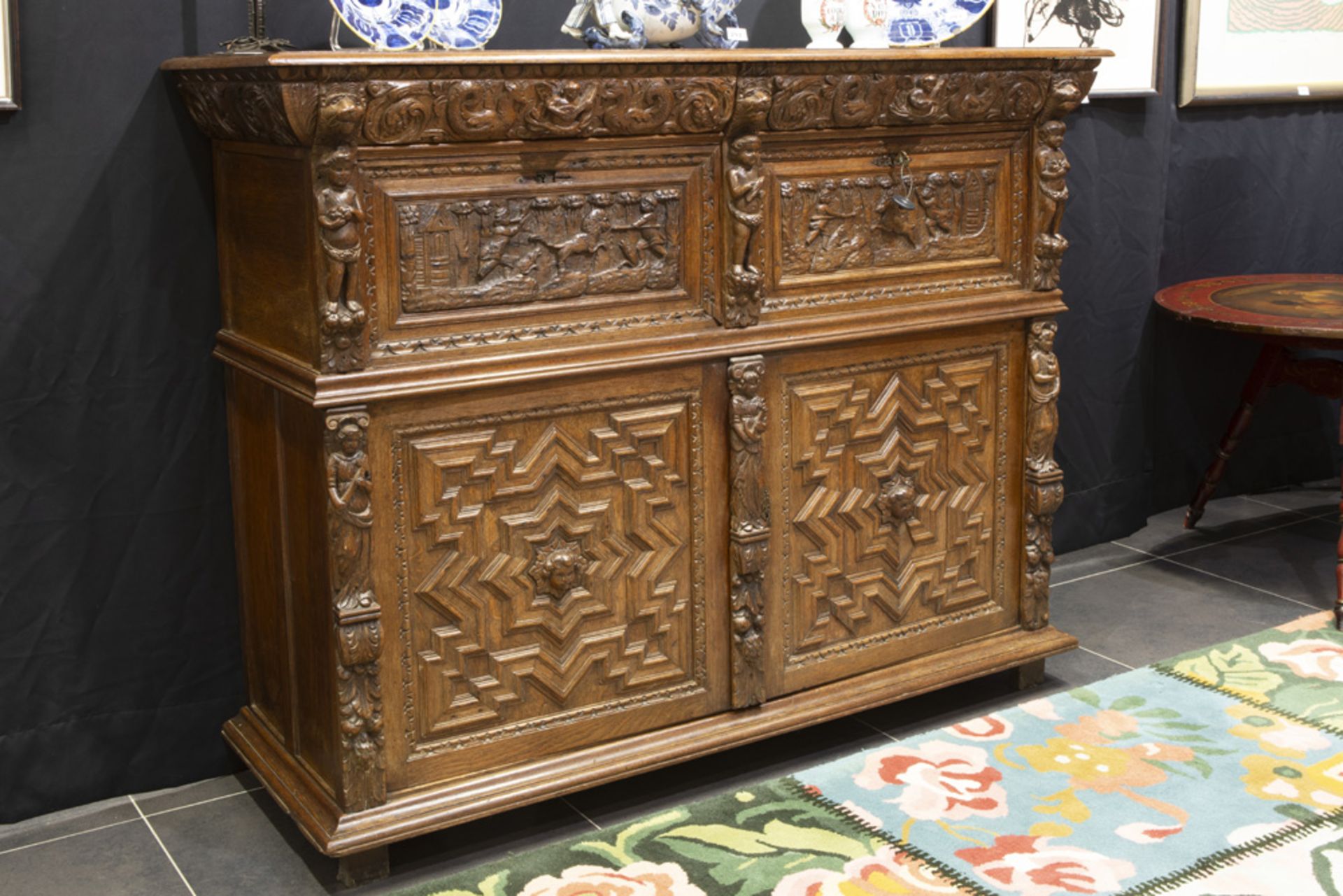 17th Cent. Flemish baroque style cupboard in oak with typical, sculpted ornamentation with