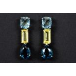 pair of earrings in white gold (18 carat) with ca 3 carat of light yellow Beryl and at least 15