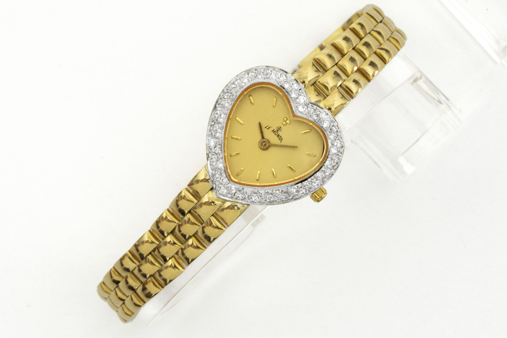 completely original "Le Monde" marked quartz ladies' wristwatch in yellow gold (18 carat) with heart