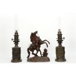 pair of paraffin lamps and a sculpture after Coustou || Lot (3) met een paar petroleumlampen (hoogte