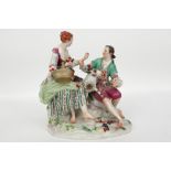 'antique' group in Meissen marked porcelain with two figures and a sheep || 'Antieke' bibelot in