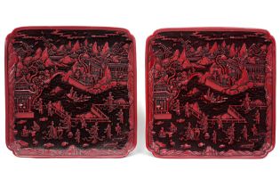 pair of nice marked Chinese trays in red lacquerware with a finely sculpted animated landscape decor