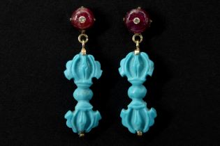 pair of Nepalese earrings in pink gold (18 carat) each with a ruby with an inlaid diamond and a