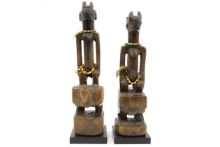 pair of African Benin Nago female twin sculptures in wood with typical beaded bands with certificate