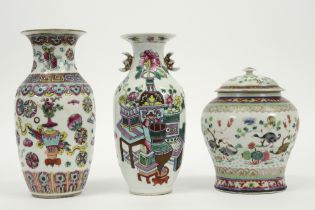 three antique Chinese vases in porcelain with a polychrome decor of which one is lidded and
