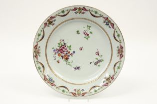 quite big 18th Cent. Chinese dish in porcelain with a 'Famille Rose' decor with flowers and festoons