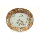 quite rare oval 18th Cent. Chinese "faux marbre" dish in porcelain with a 'Famille Rose' flower