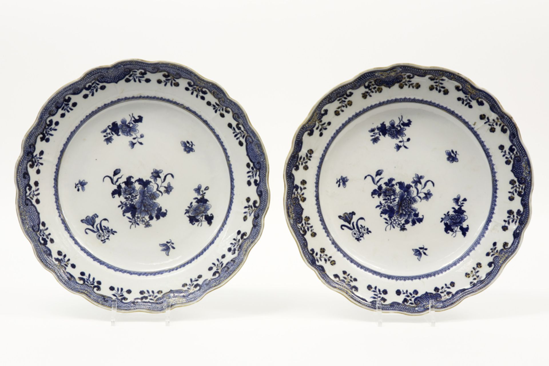 pair of quite big round 18th Cent. Chinese dishes in porcelain with a floral blue-white (with