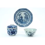 three pieces of 18th Cent. Chinese porcelain with a blue-white decor : a plate a lidded pot and a