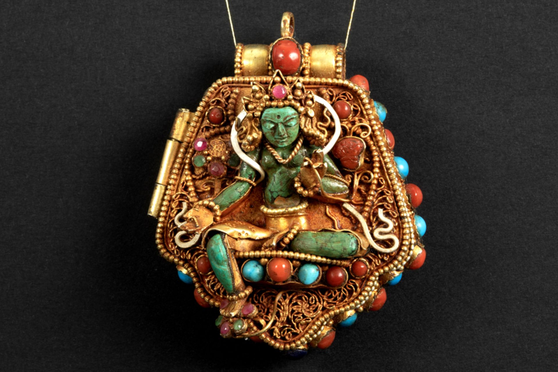 Tibeto Nepalese ghau in yellow gold on silver with turquoise, lapis lazuli, coral, ruby and