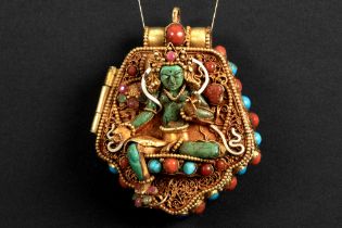 Tibeto Nepalese ghau in yellow gold on silver with turquoise, lapis lazuli, coral, ruby and