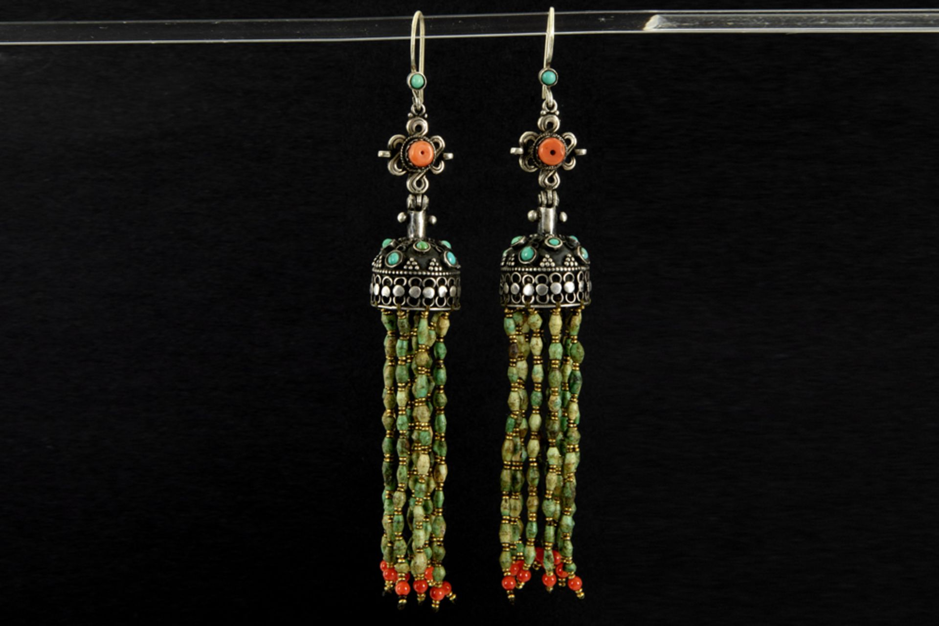 pair of antique Himalayan earrings in silver with coral and turquois and with tassels in