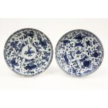pair of quite large round 18th Cent. Chinese dishes in porcelain with a rich floral blue-white decor