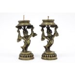pair of vintage Nepalese temple candlesticks in a copper alloy with a dancing mythical animal ||