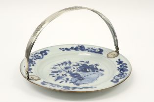 18th Cent. Chinese dish in porcelain with a blue-white decor with tobacco leaf and vase and with a