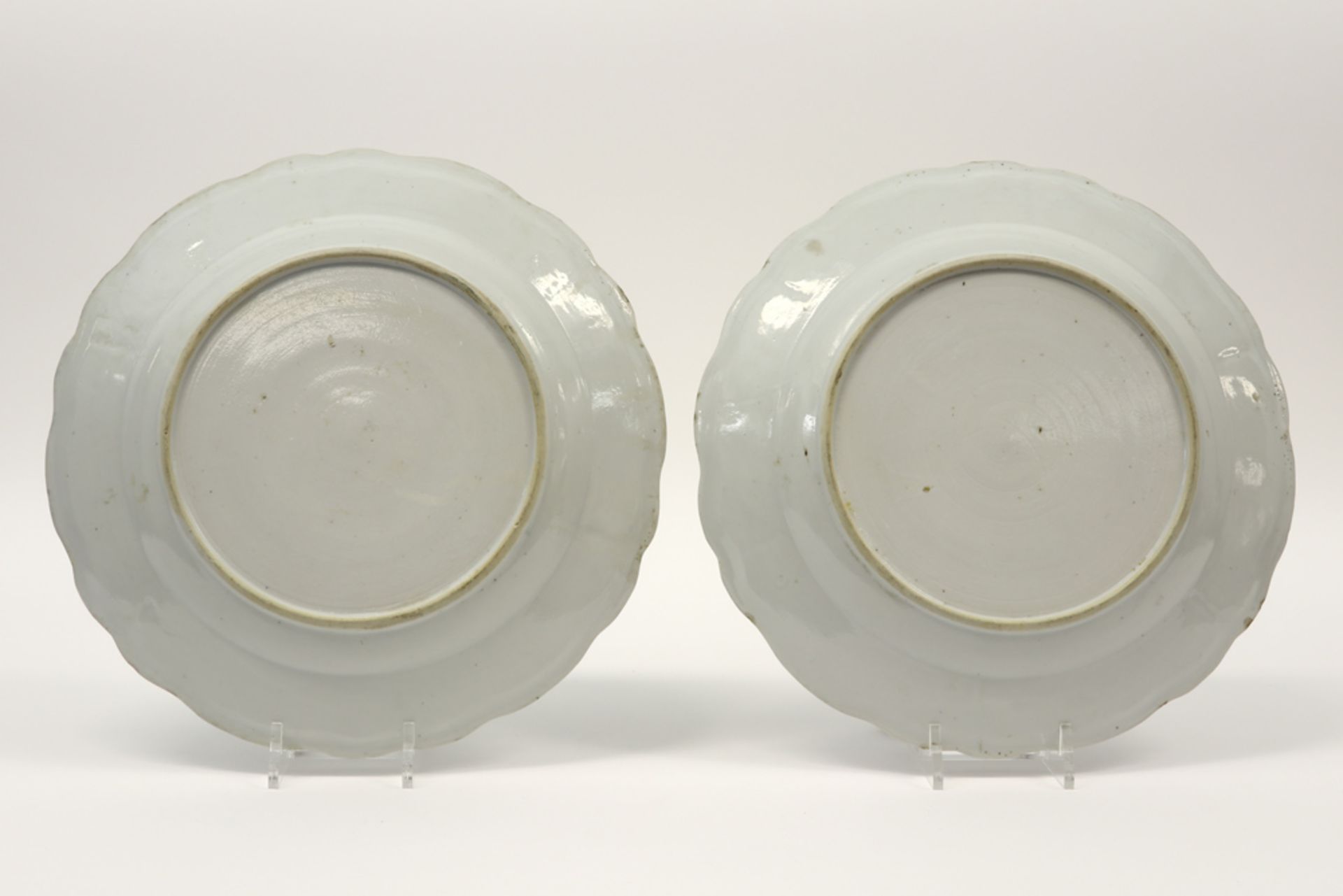 pair of quite big round 18th Cent. Chinese dishes in porcelain with a floral blue-white (with - Image 2 of 2