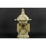 antique quite big Chinese house altar in carved ivory with a shrine with two doors hiding Boeddha