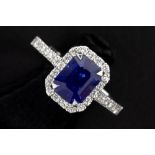 ring in white gold (18 carat) with a 2,15 carat intense blue sapphire surrounded by 0,24 carat of