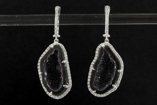pair of contemporary very fashionable earrings in white gold (18 carat), each with half a geode of