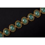 vintage bracelet in yellow gold (18 carat) with eight oval green cabochon cut stones, presumably