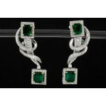 matching pair of earrings with a similar design with a snake shape in white gold (18 carat) with