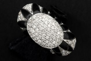 ring in white gold (18 carat) with black enamel and more then 0,80 carat of high quality brilliant